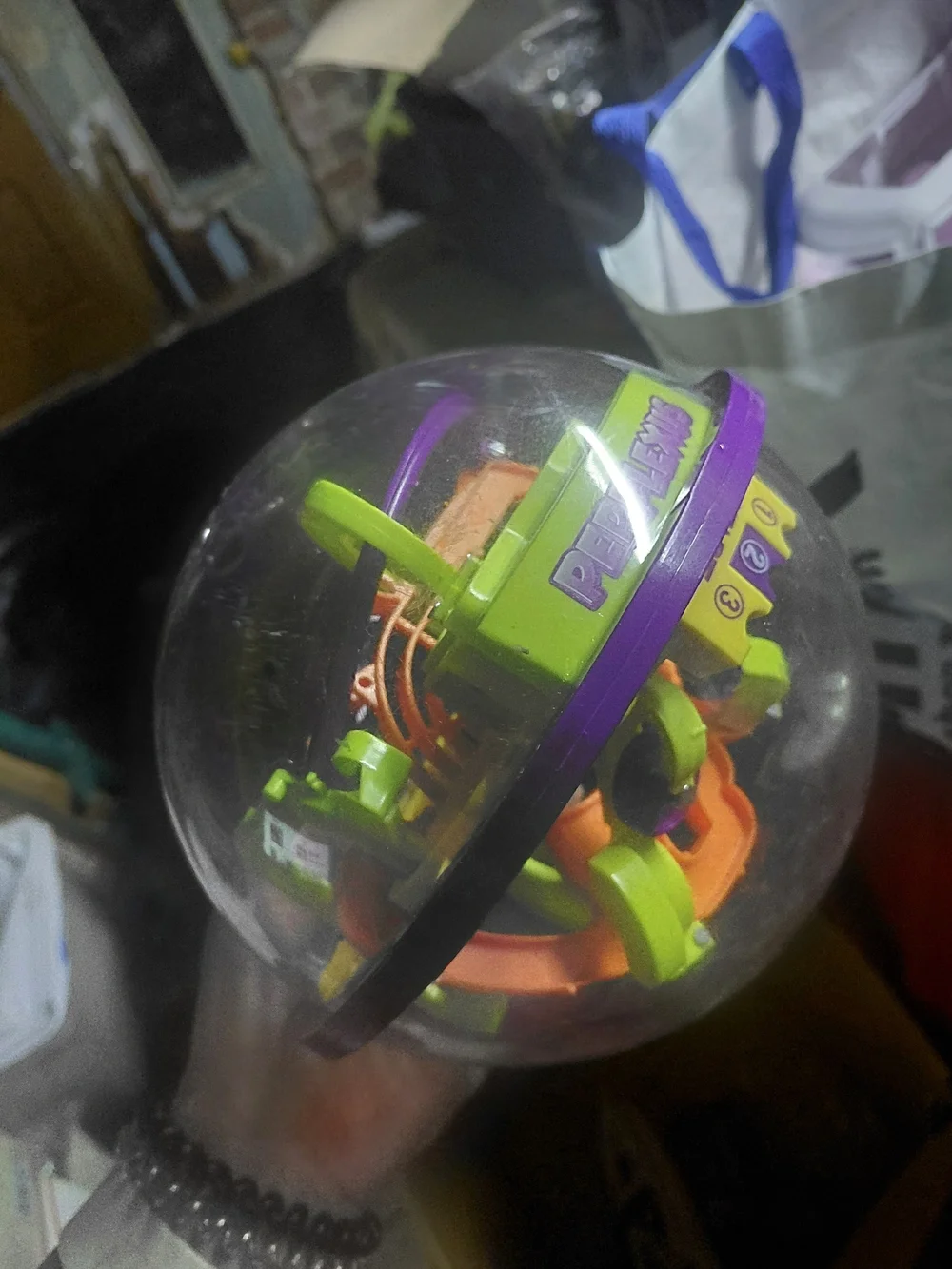 puzzle is the Spin Master Perplexus Original 3D labyrinth game
